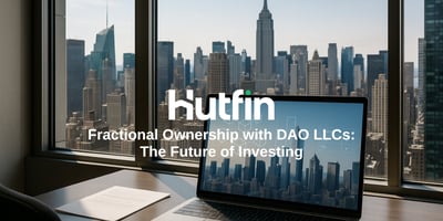 A modern office desk overlooking a city skyline with a laptop displaying blockchain graphics on the screen. The text on the image reads, “Hutfin – Fractional Ownership with DAO LLCs: The Future of Investing.”