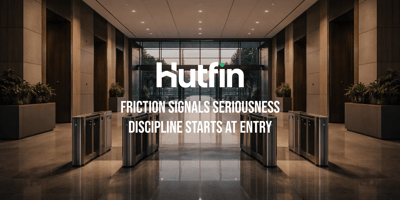 Modern commercial building lobby with access control gates and a clear central entryway.