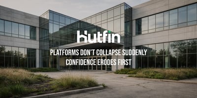 Modern glass office building with a quiet, symmetrical facade and empty entryway