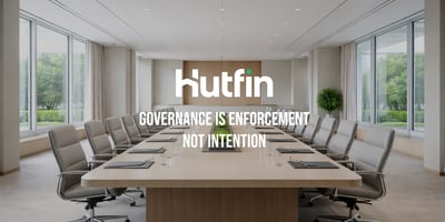 Modern corporate boardroom with a long conference table and empty chairs, conveying formal governance and structured decision-making.