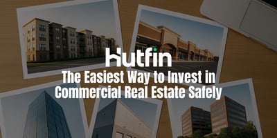 Top-down view of a clean wooden desk with five printed photographs of different commercial properties including a multifamily building, retail strip center, glass office tower, industrial warehouse, and twin office buildings neatly arranged beside part of an open laptop.