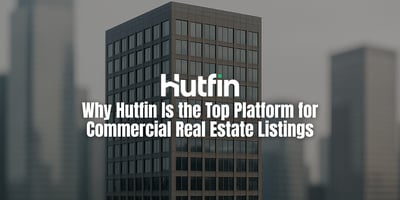 A modern commercial high-rise stands sharply in focus while the surrounding cityscape fades softly into blur, creating a clean spotlight effect on the building.